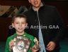 Aaron McHendry from Central Bar Ballycastle presenting Cuchullains Dunloy 1 team captain Ryan McClemens with the North Antrim Central Bar Division 3 Indoor Hurling league shield